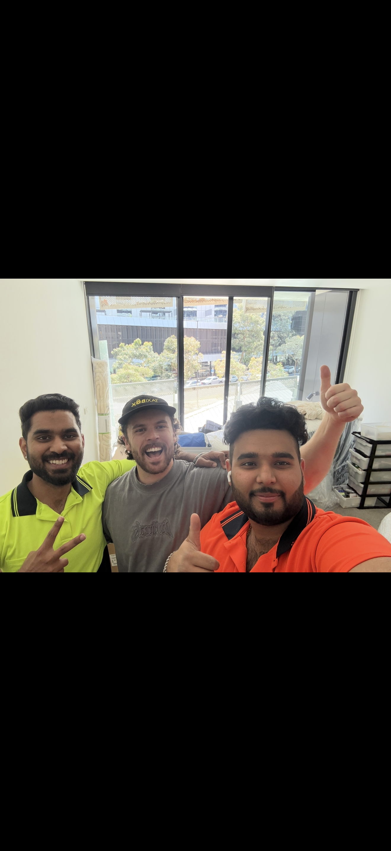 Team with smiling customer after apartment move