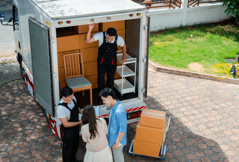 Professional removalists loading household furniture into a moving truck during a home move in Tarneit